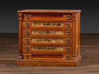 A Six-Drawer Oak Spool Cabinet