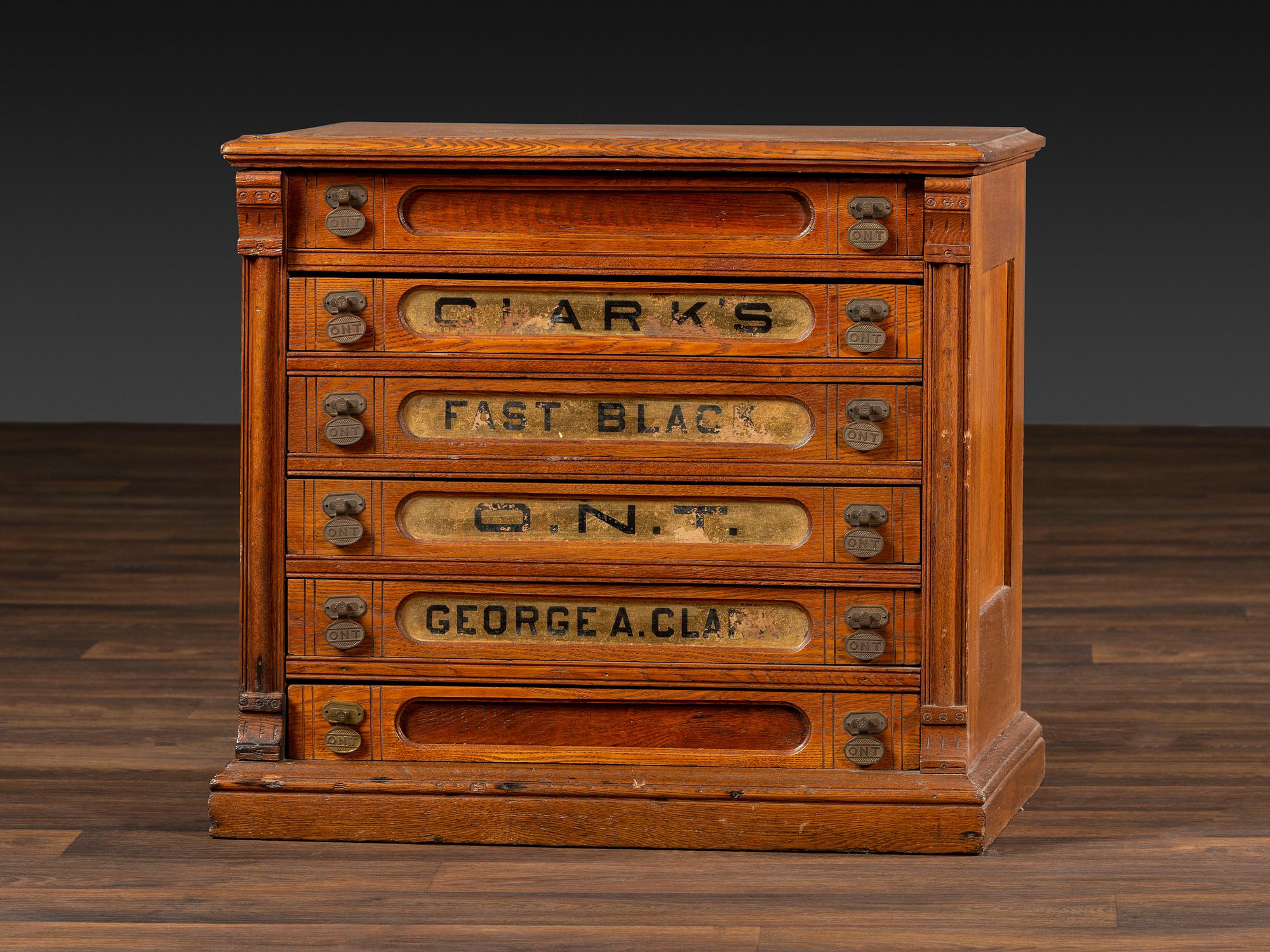 A Six-Drawer Oak Spool Cabinet