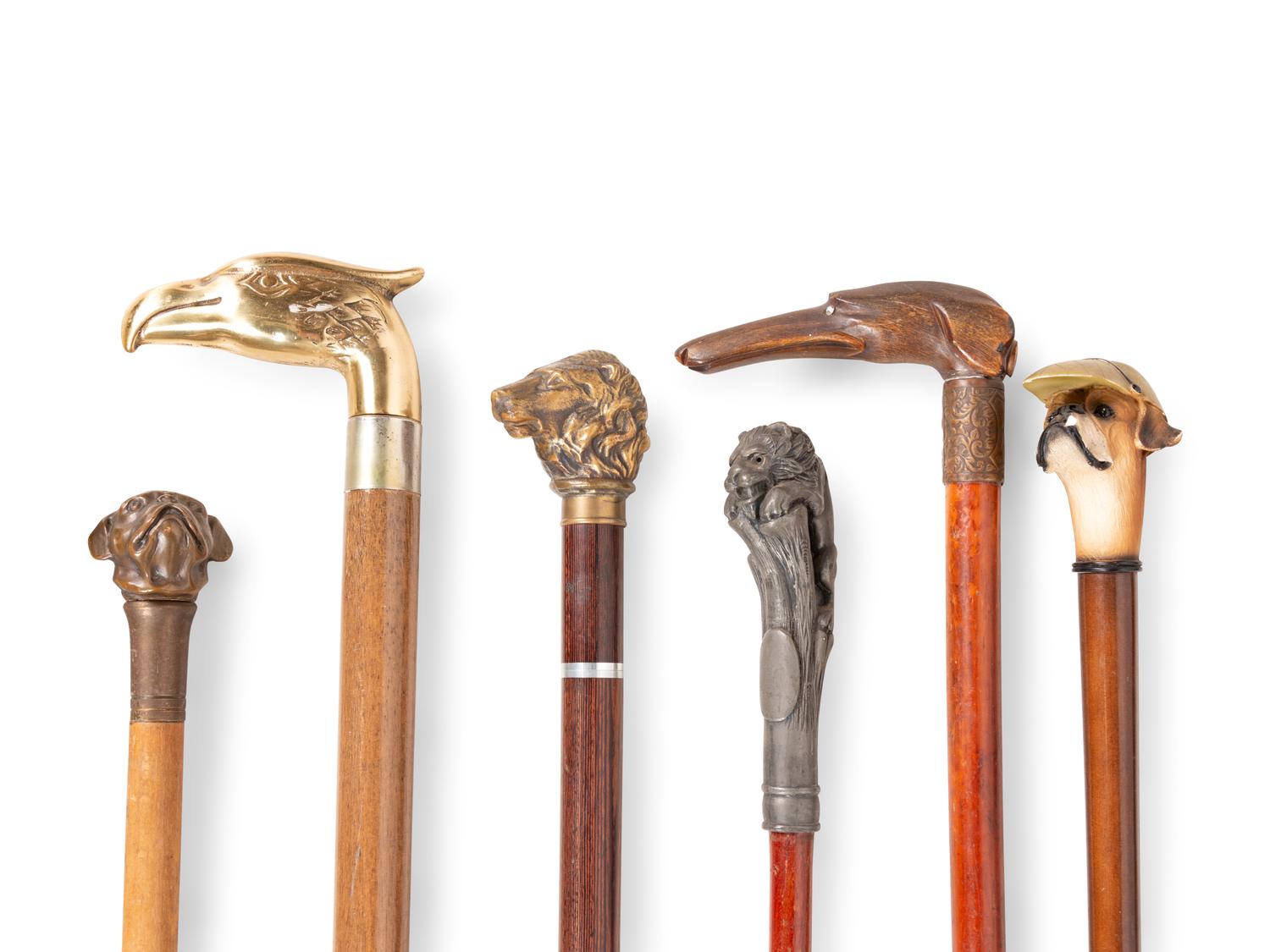 A Collection of Sixteen Carved and Mixed Metal Decorated Zoomorphic Walking Sticks