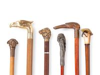 A Collection of Sixteen Carved and Mixed Metal Decorated Zoomorphic Walking Sticks