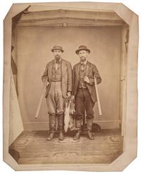 [EARLY PHOTOGRAPHY]. Large format albumen photograph of two armed hunters posed with their game. N.p.: n.p., n.d.
