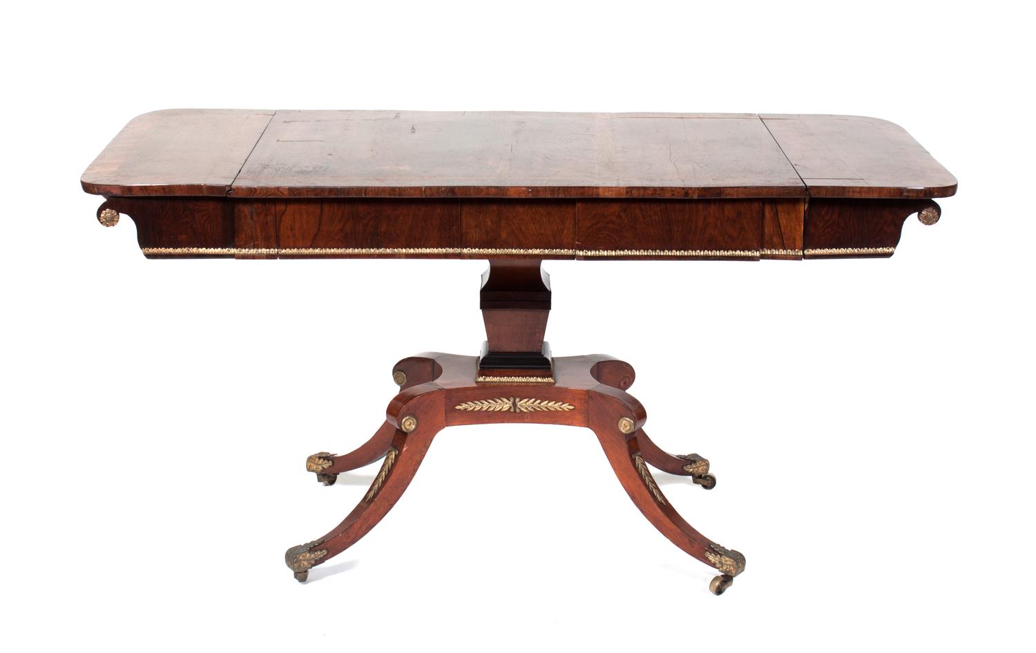 A Regency Gilt Metal Mounted Rosewood Sofa Table Height 27 3/4 x width 54 1/2 x depth 24 3/4 inches.