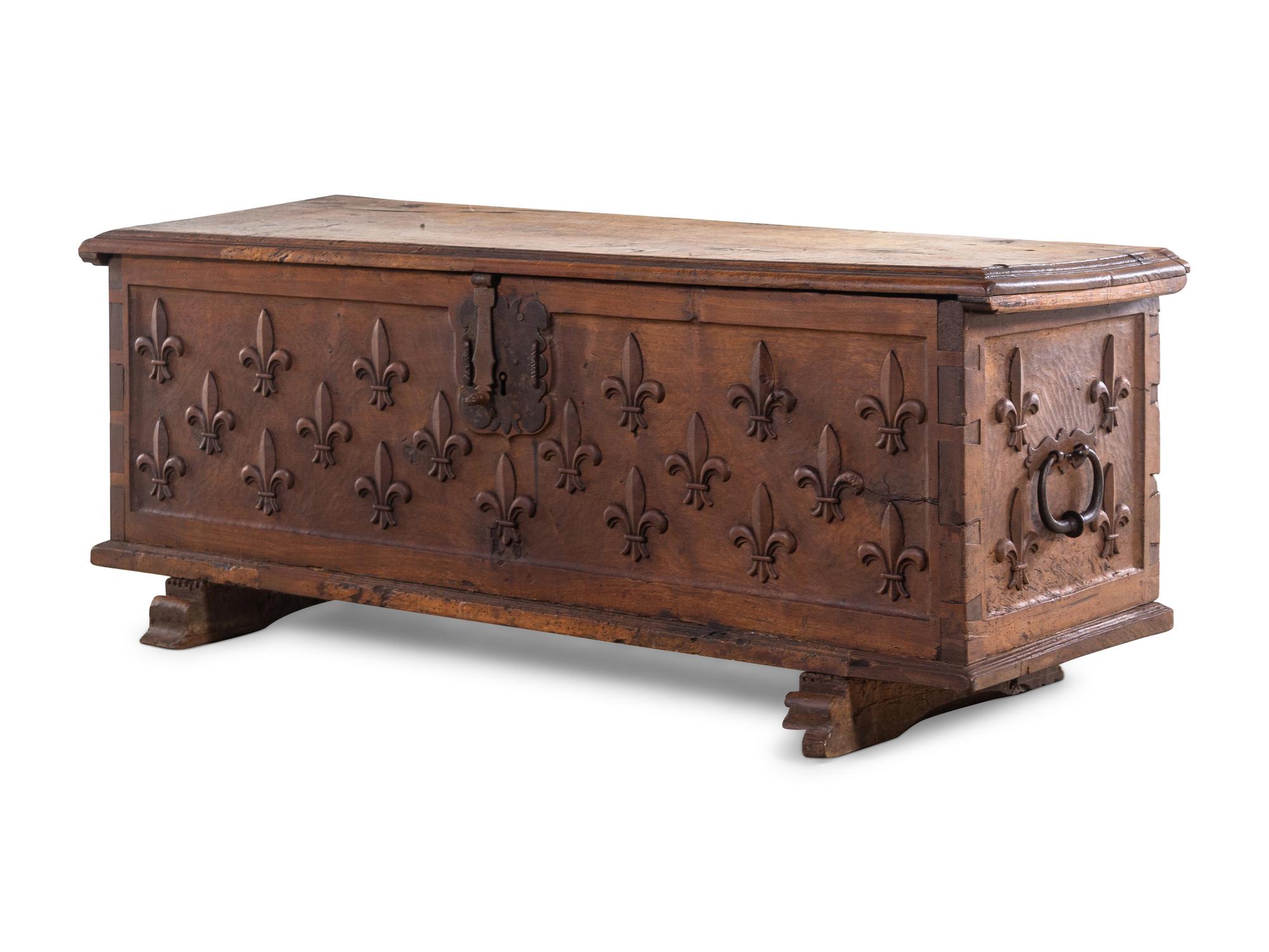 A Continental Carved Walnut Cassone