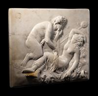 A Continental Carved Marble Relief Depicting a Satyr and a Bacchante