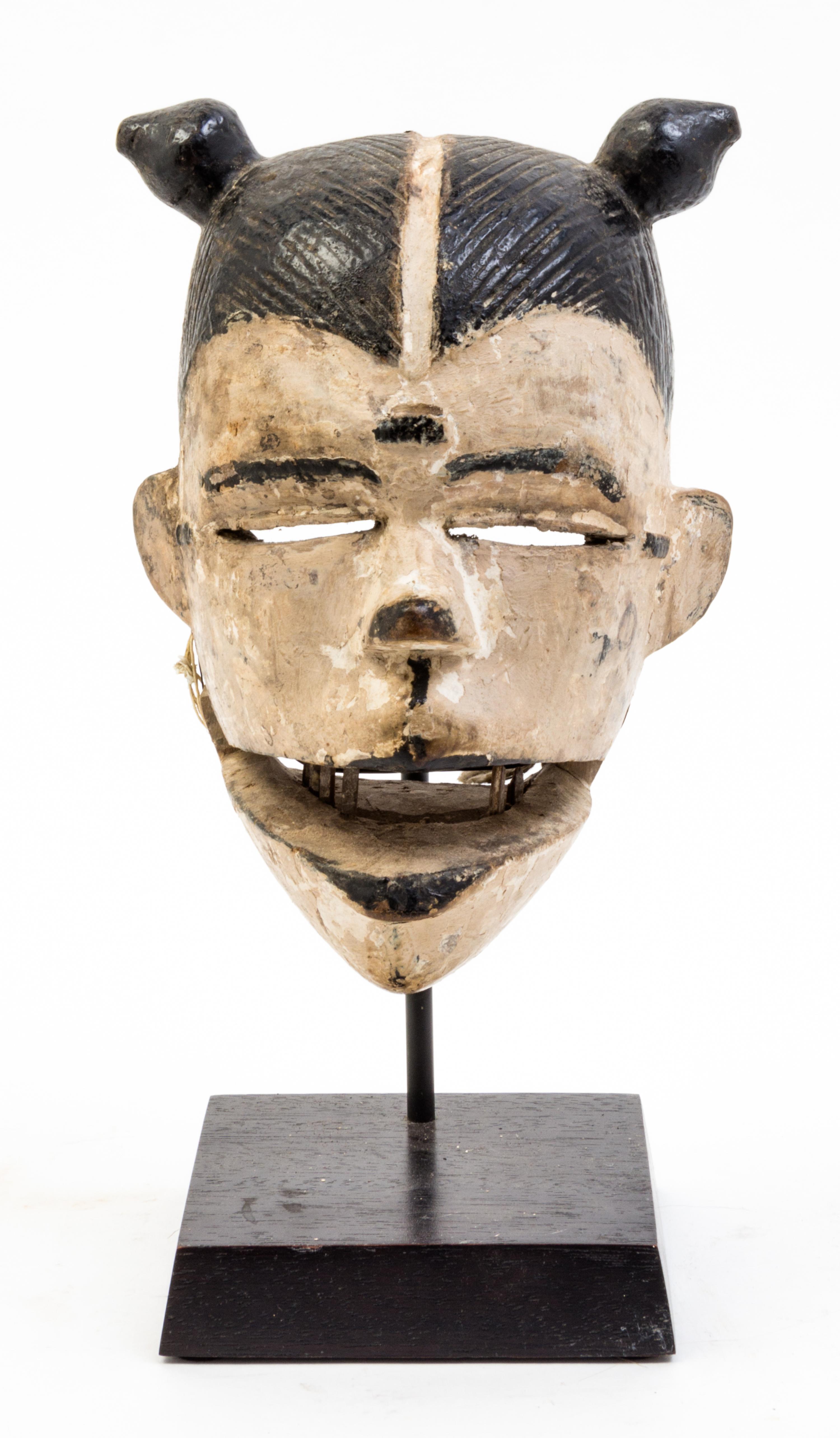A White-Faced Punu Mask Height overall 10 1/4 inches.
