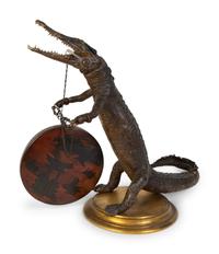 A Taxidermy Cayman Crocodile with Gong — 20TH CENTURY