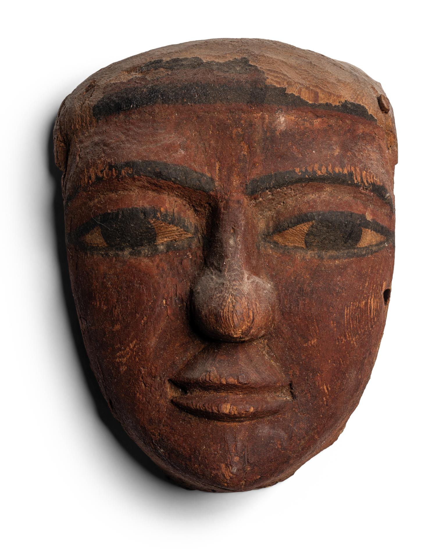 An Egyptian Painted Wood Mummy Mask