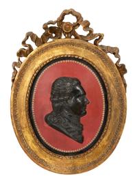 A Pair of Giltwood Framed Ebonized Relief Portrait Plaques of French Nobility, 18th Century