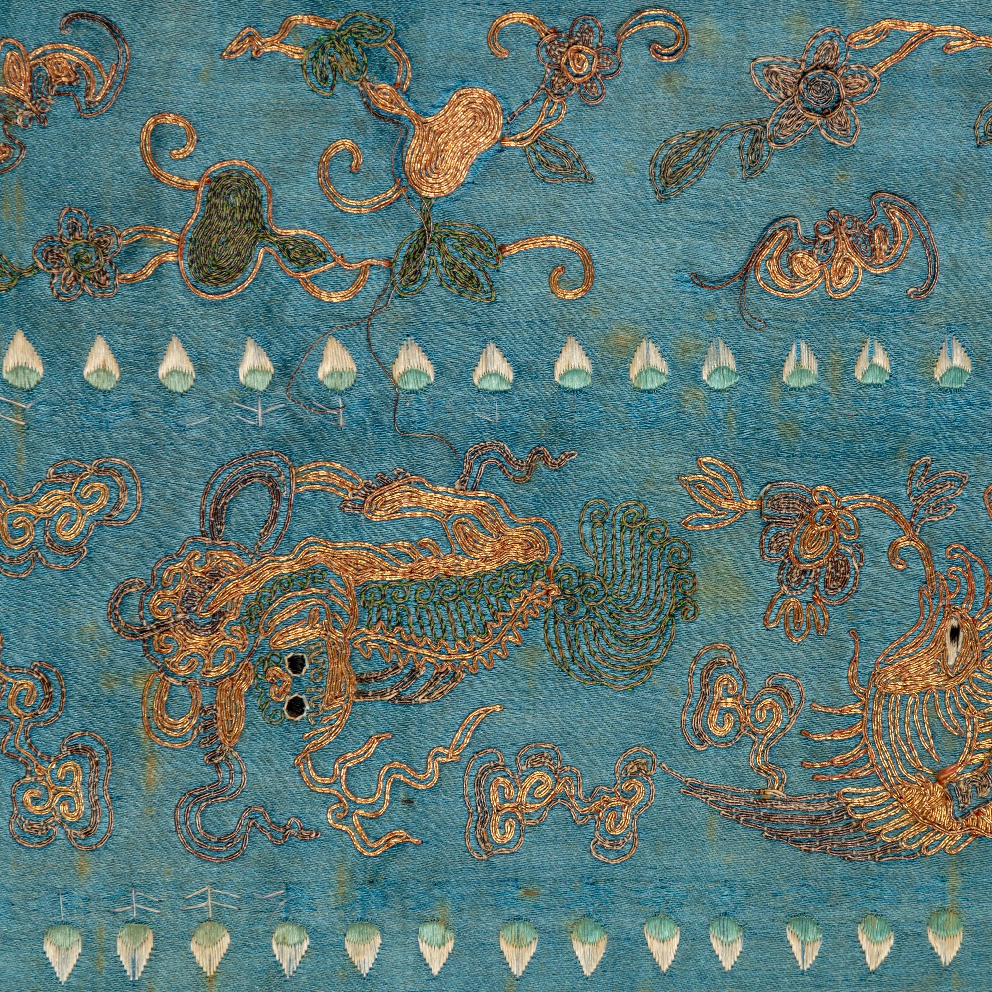 Two Chinese Midnight-Blue Ground Embroidered Silk Lady's Robes, 19th Century 清晚期 石青地綉花女褂兩件