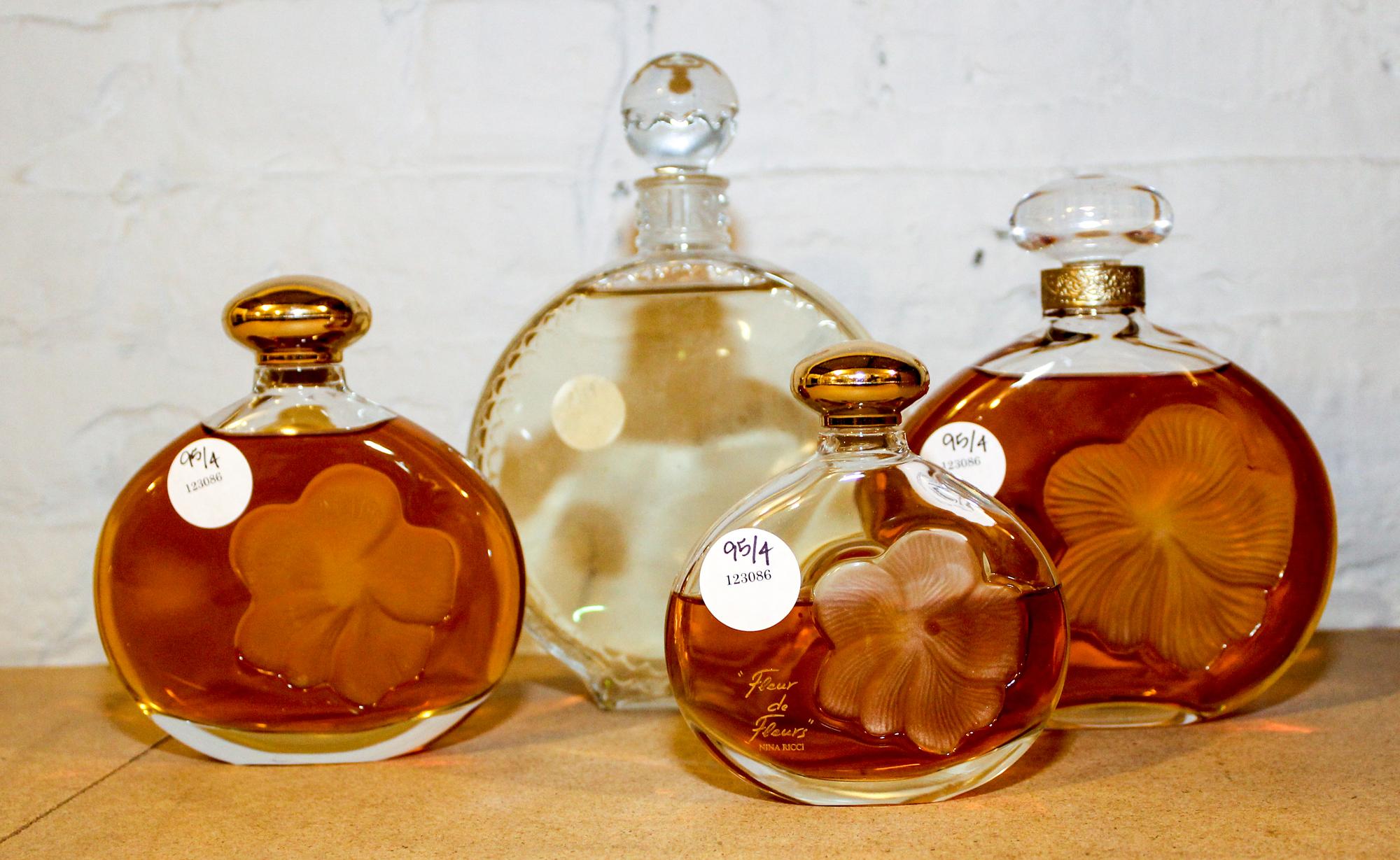 Four Large French Glass Perfume Bottles. Height of tallest 8 1/2 inches.