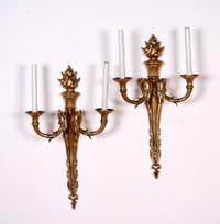 A Pair of Louis XVI Style Two-Light Gilt Bronze Wall Sconces, Height of backplate 23 inches.