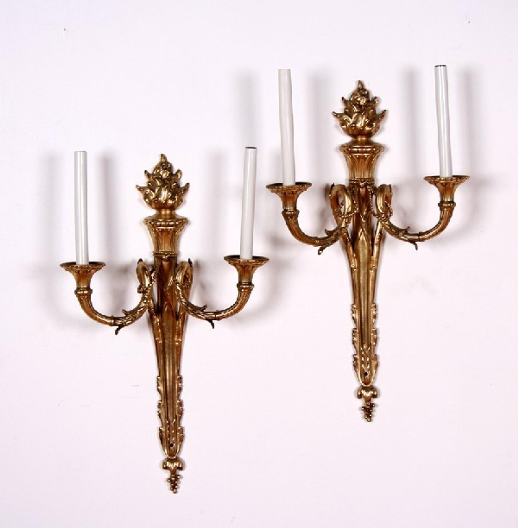 A Pair of Louis XVI Style Two-Light Gilt Bronze Wall Sconces, Height of backplate 23 inches.