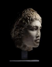 A Roman Marble Head of a Youth Wearing a Laurel Wreath