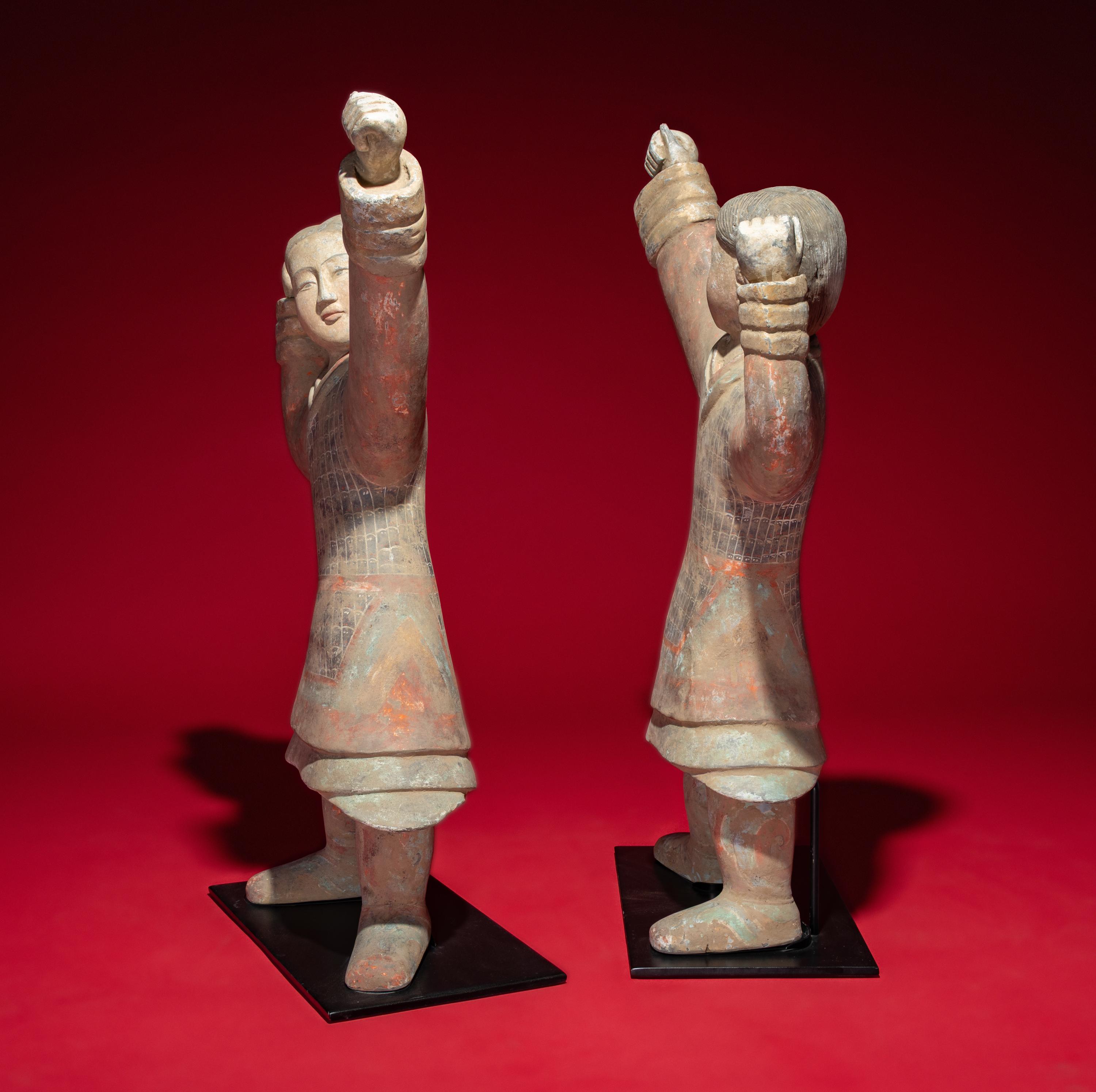 A Large Pair of Chinese Painted Pottery Archers, Western Han Dynasty — 西漢 彩繪射姿立俑一對