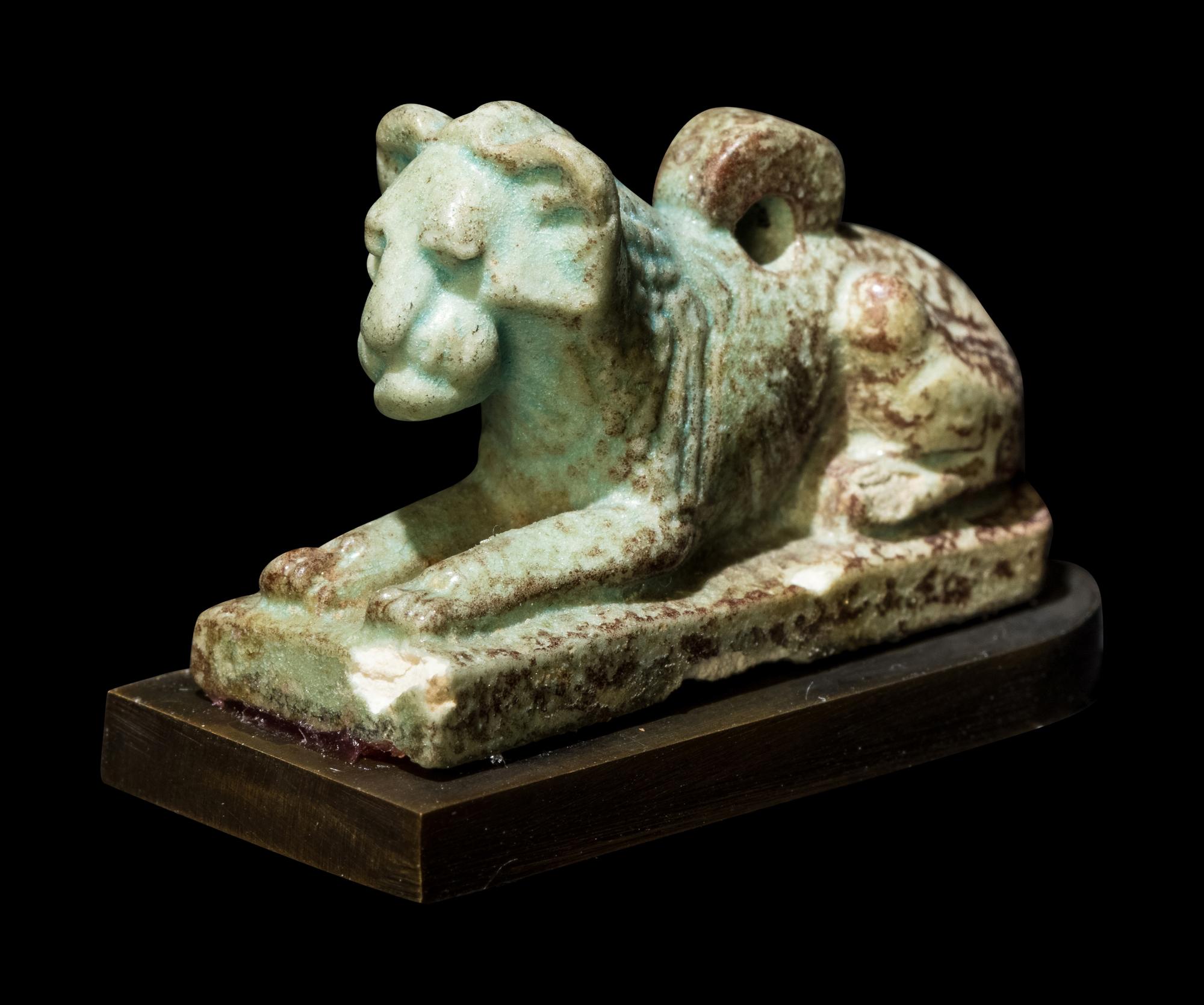 An Egyptian Faience Recumbent Lion