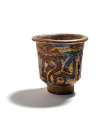 An Islamic Blue, Green and Iridescent Gold Glazed Pottery Cup