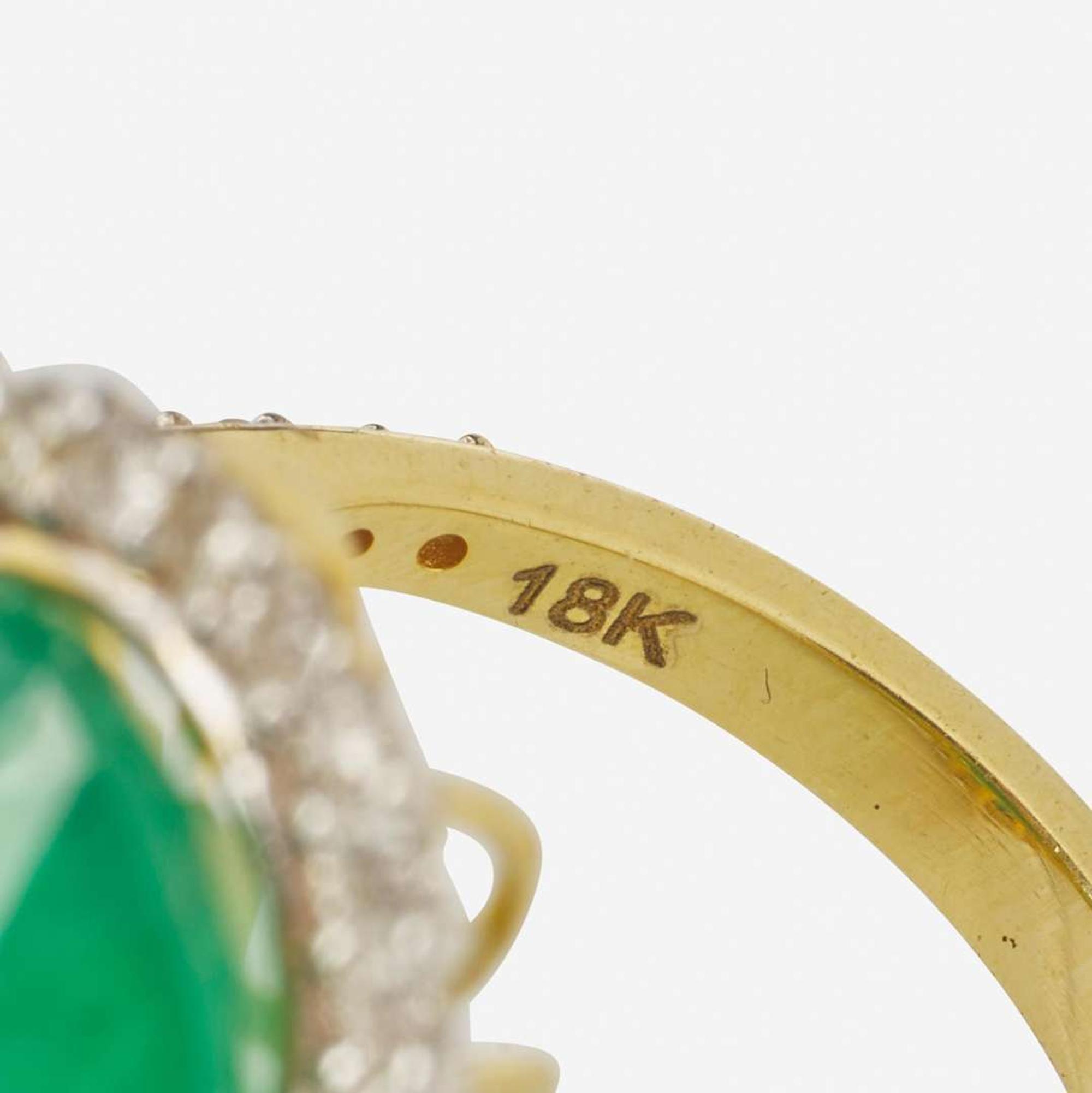 An 18K Yellow Gold, Emerald, and Diamond Ring