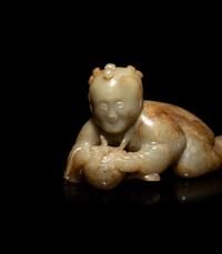 A Chinese Russet and Pale Celadon Jade Figure of a Boy