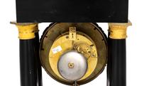 A Charles X Gilt Bronze Mounted Ebonized Fruitwood Clock