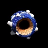 A Phoenician Glass Triple-Face Bead