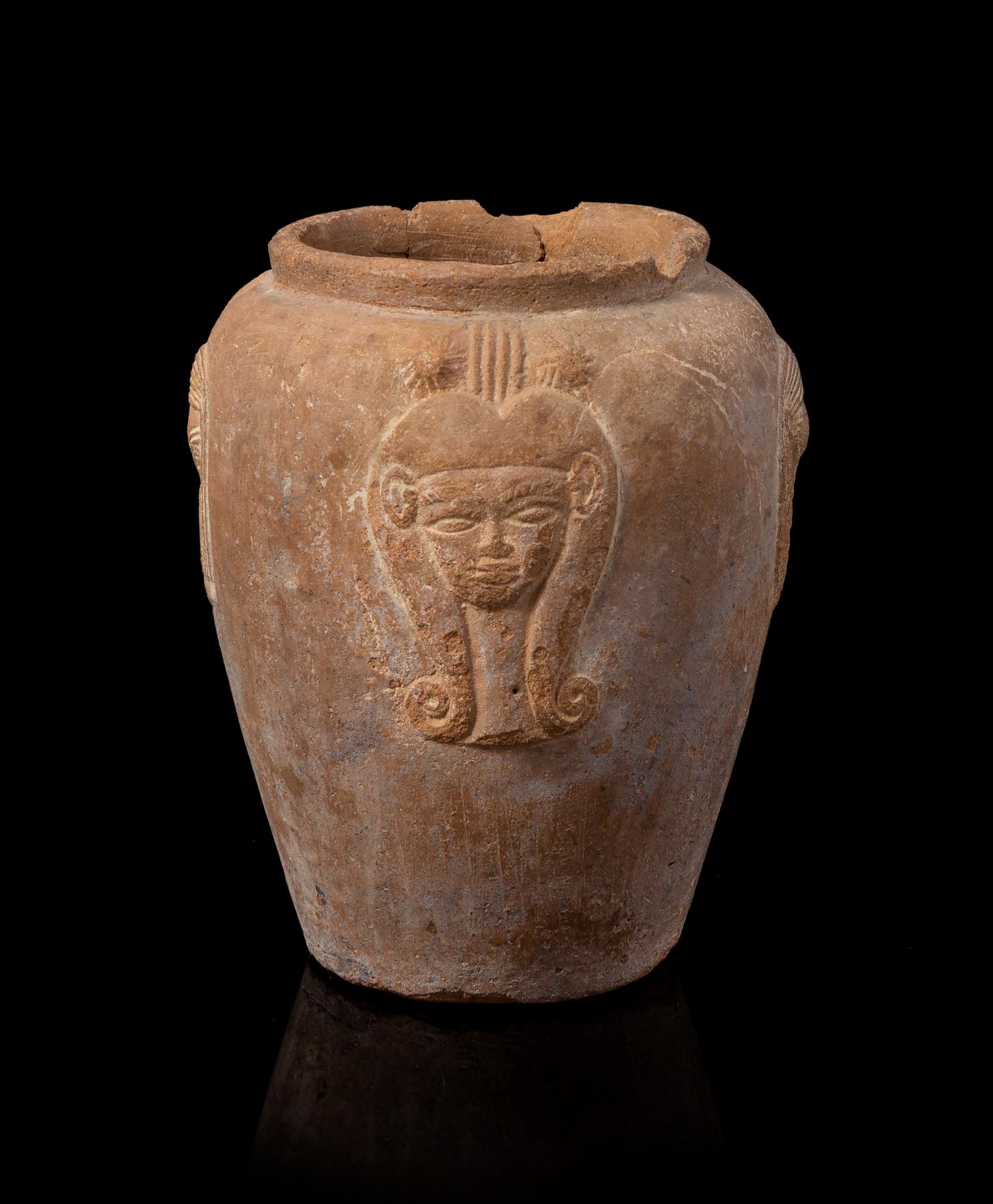 An Egyptian Terra Cotta Jar with Hathor Height 4 1/4 inches. — NEW KINGDOM, DYNASTY 18-19, 1550-1196 B.C.E.
