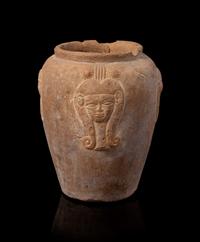 An Egyptian Terra Cotta Jar with Hathor Height 4 1/4 inches. — NEW KINGDOM, DYNASTY 18-19, 1550-1196 B.C.E.