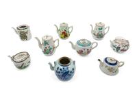 A Group of Nine Chinese Porcelain Teapots