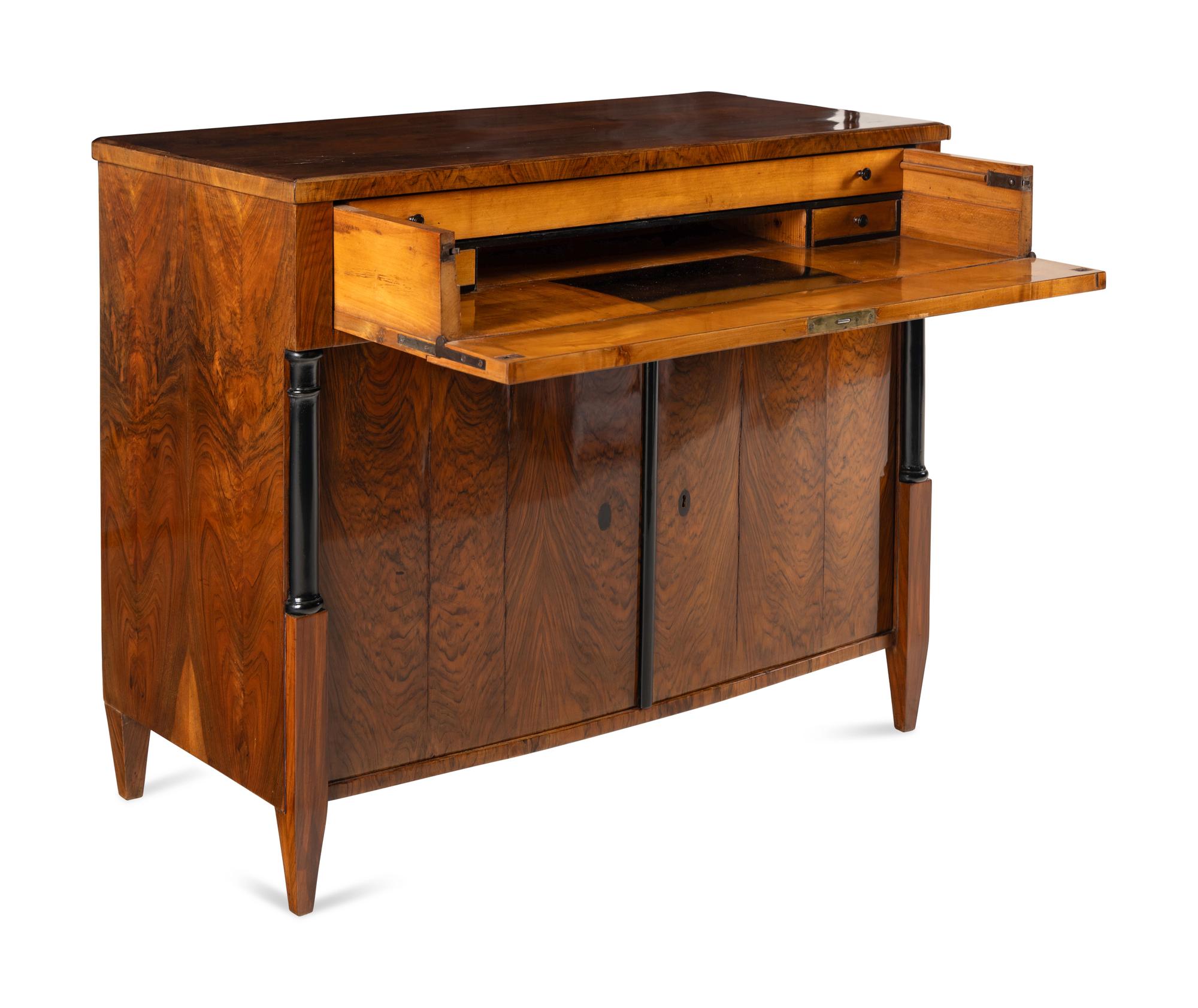An Austrian Walnut and Part-Ebonized Bureau Commode