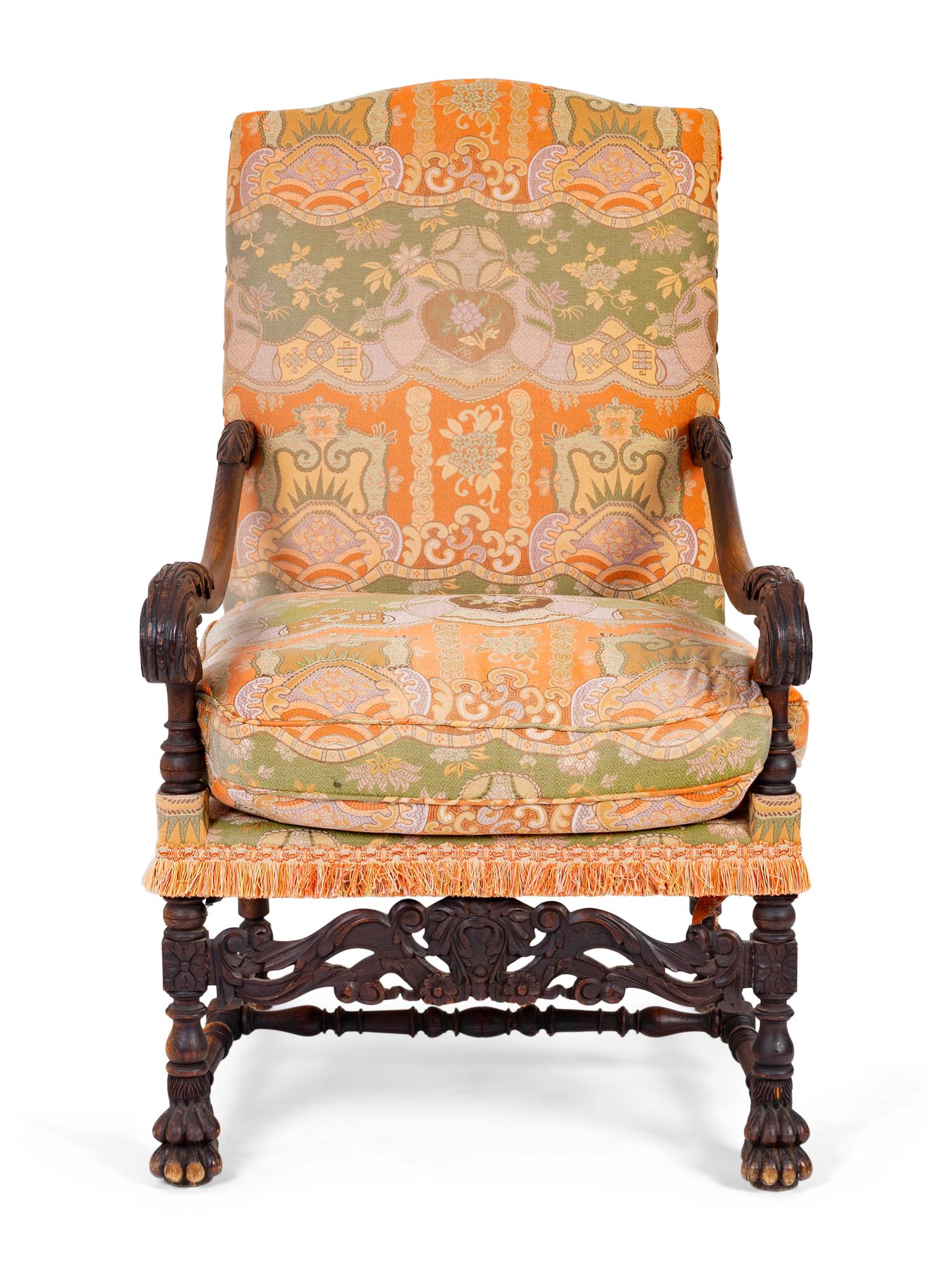 A Spanish Colonial Style Carved Walnut Open Armchair — 19TH/20TH CENTURY