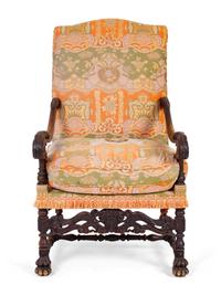 A Spanish Colonial Style Carved Walnut Open Armchair — 19TH/20TH CENTURY