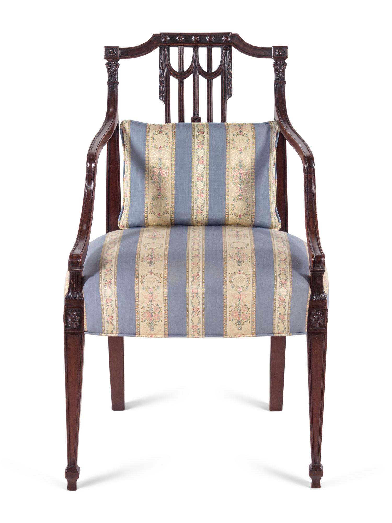 A George III Carved Mahogany Armchair