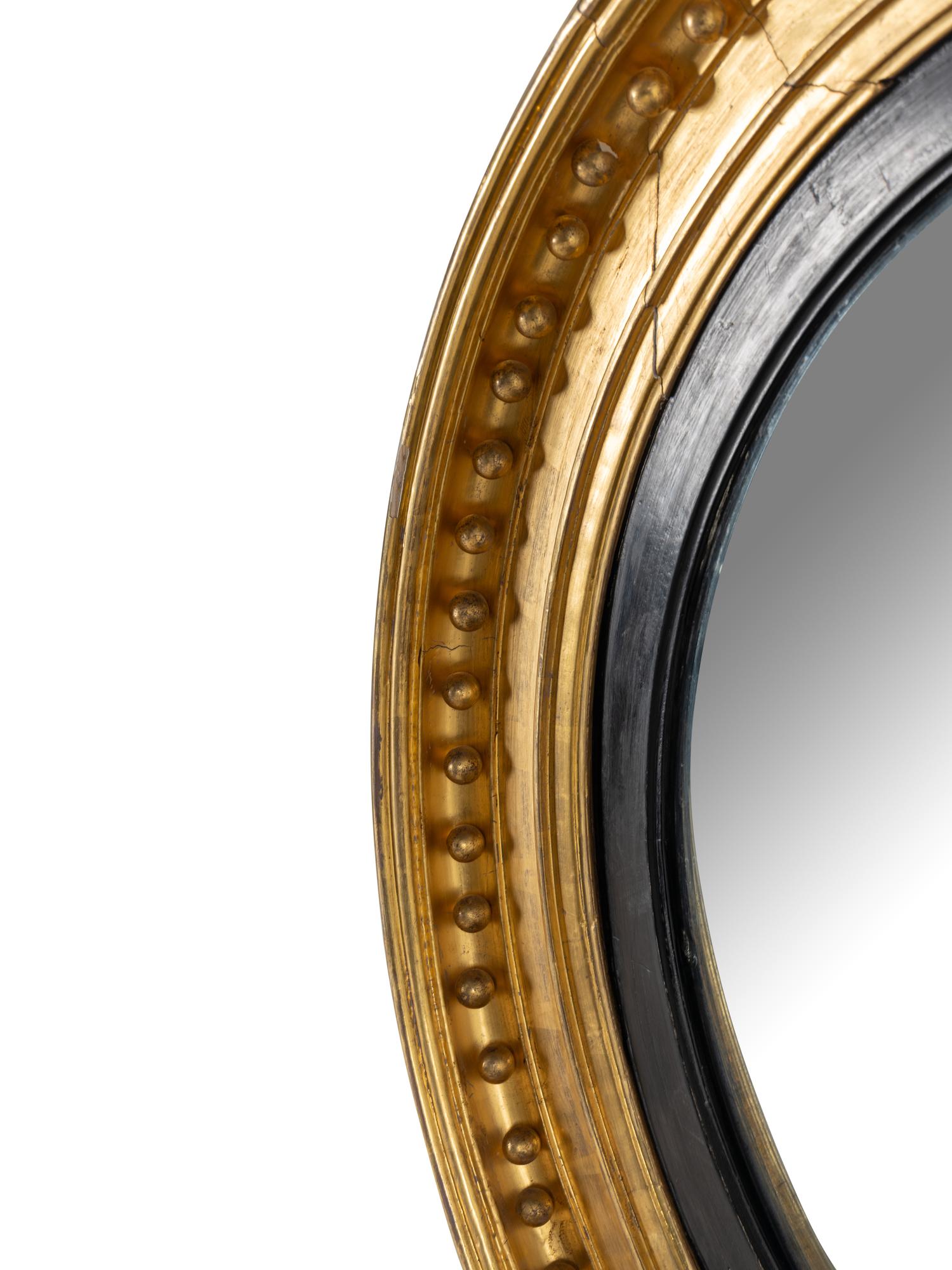 A Regency Style Gilt Gesso Bull's-Eye Mirror