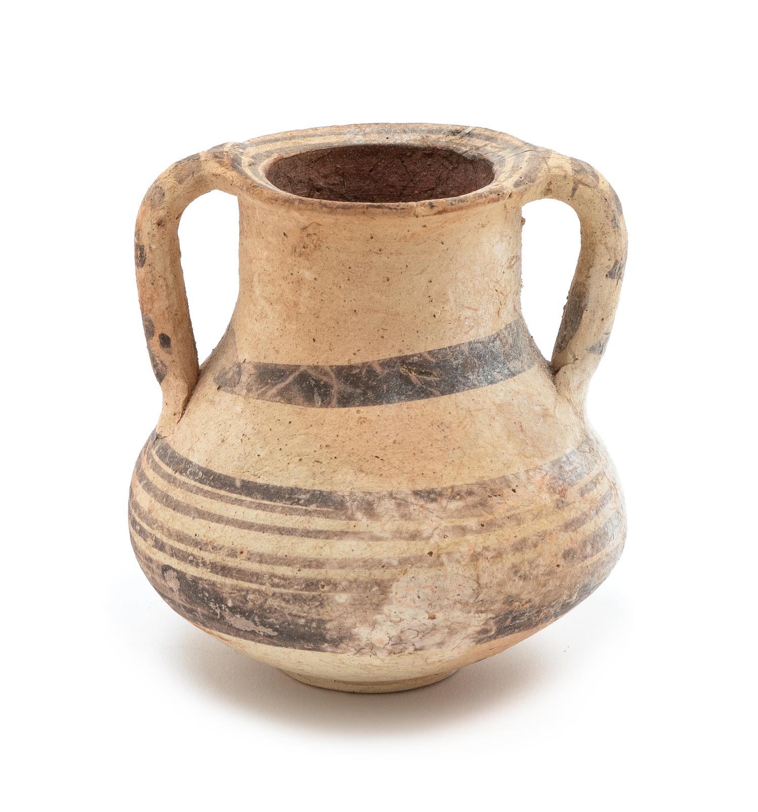A Mediterranean Terra Cotta Amphora Height 3 3/4 inches.