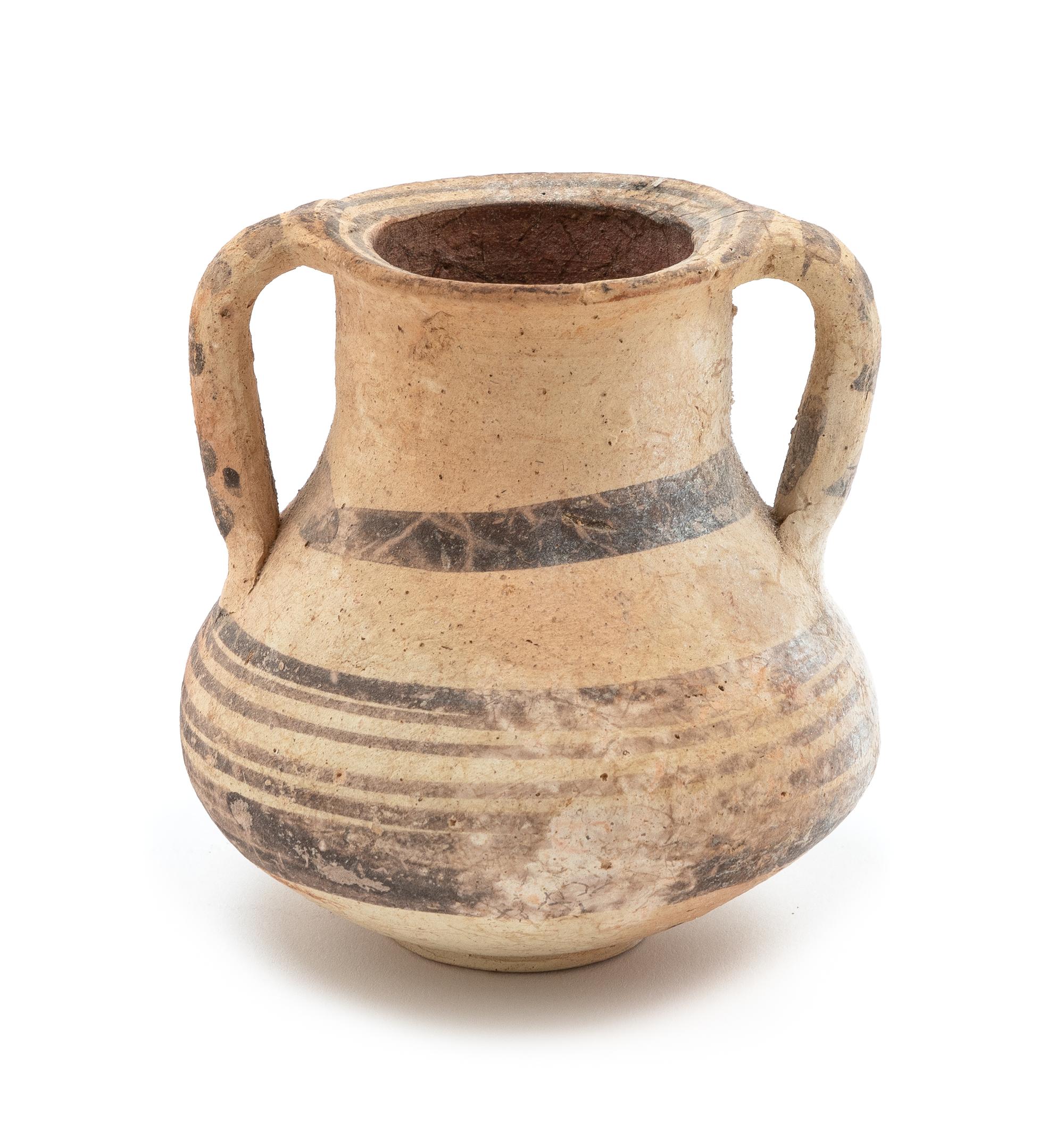 A Mediterranean Terra Cotta Amphora Height 3 3/4 inches.