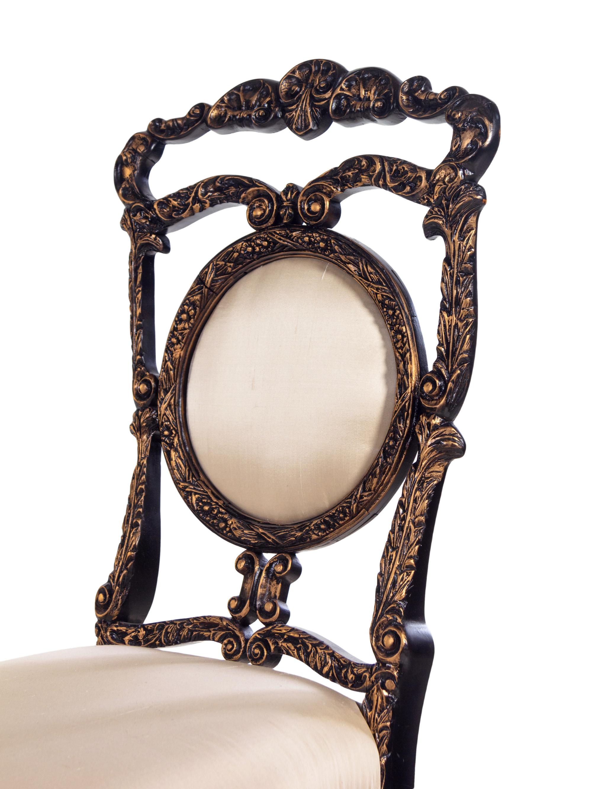 A Pair of Louis XV Style Ebonized and Gilded Side Chairs