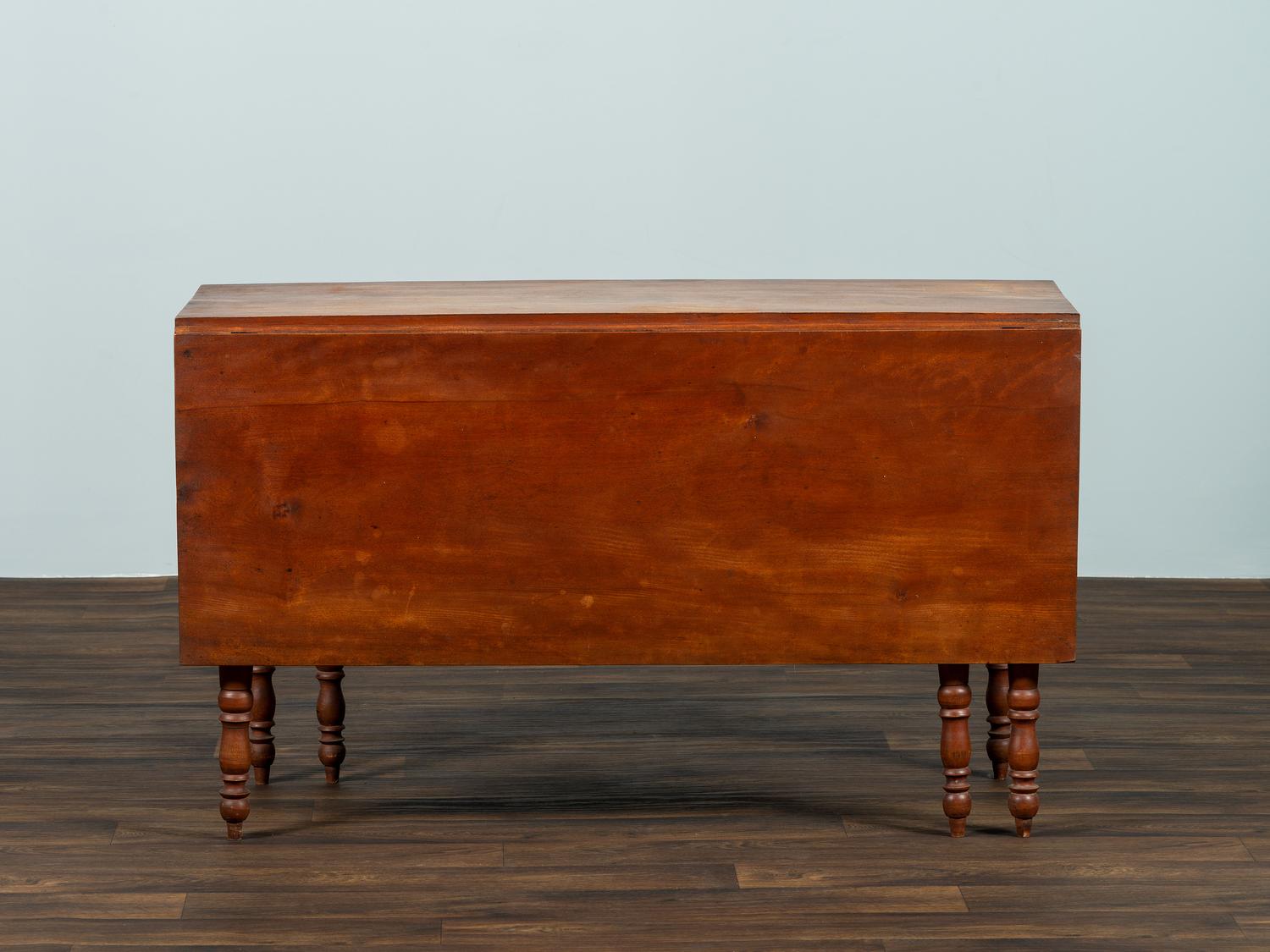 A Late Federal Cherrywood Drop-Leaf Dining Table