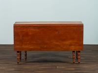 A Late Federal Cherrywood Drop-Leaf Dining Table