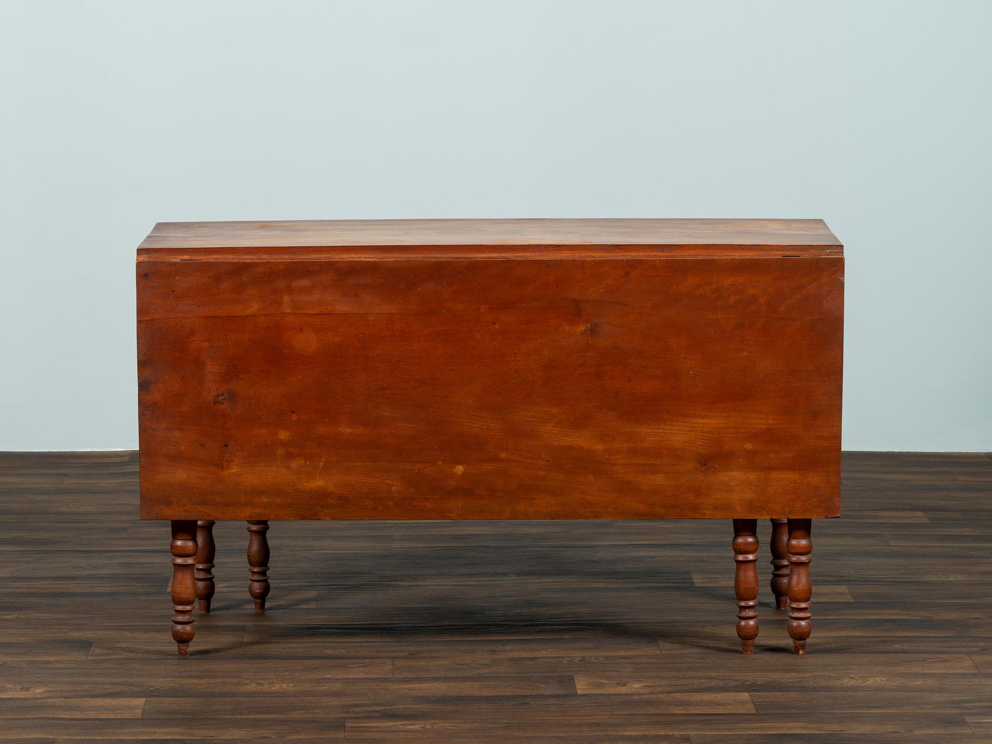 A Late Federal Cherrywood Drop-Leaf Dining Table