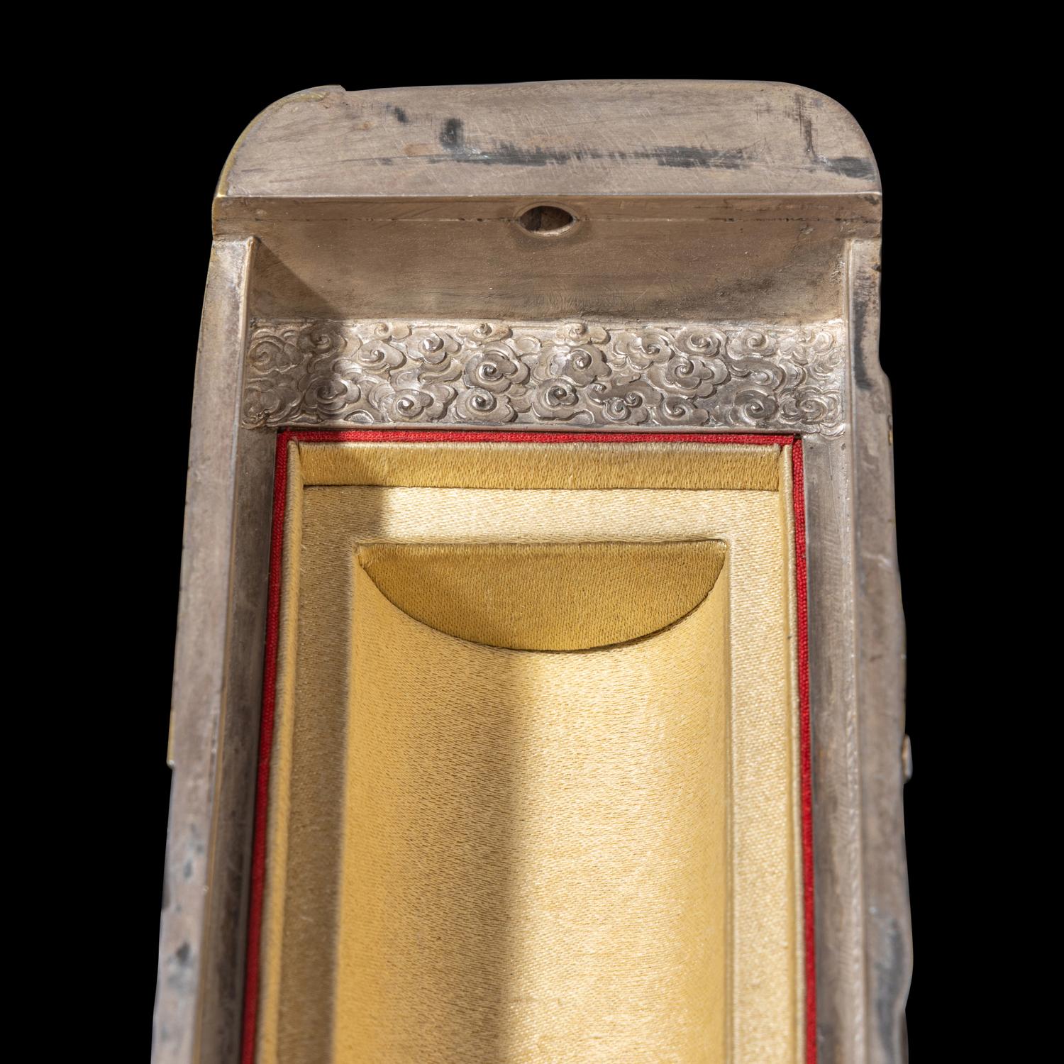 A Chinese Parcel-Gilt Silver Repoussé 'Plantain Leaves' Rectangular Scroll Box, Incised Qianlong Mark 清乾隆乙卯（1796）銀鎏金鏨蕉葉紋手卷機關盒