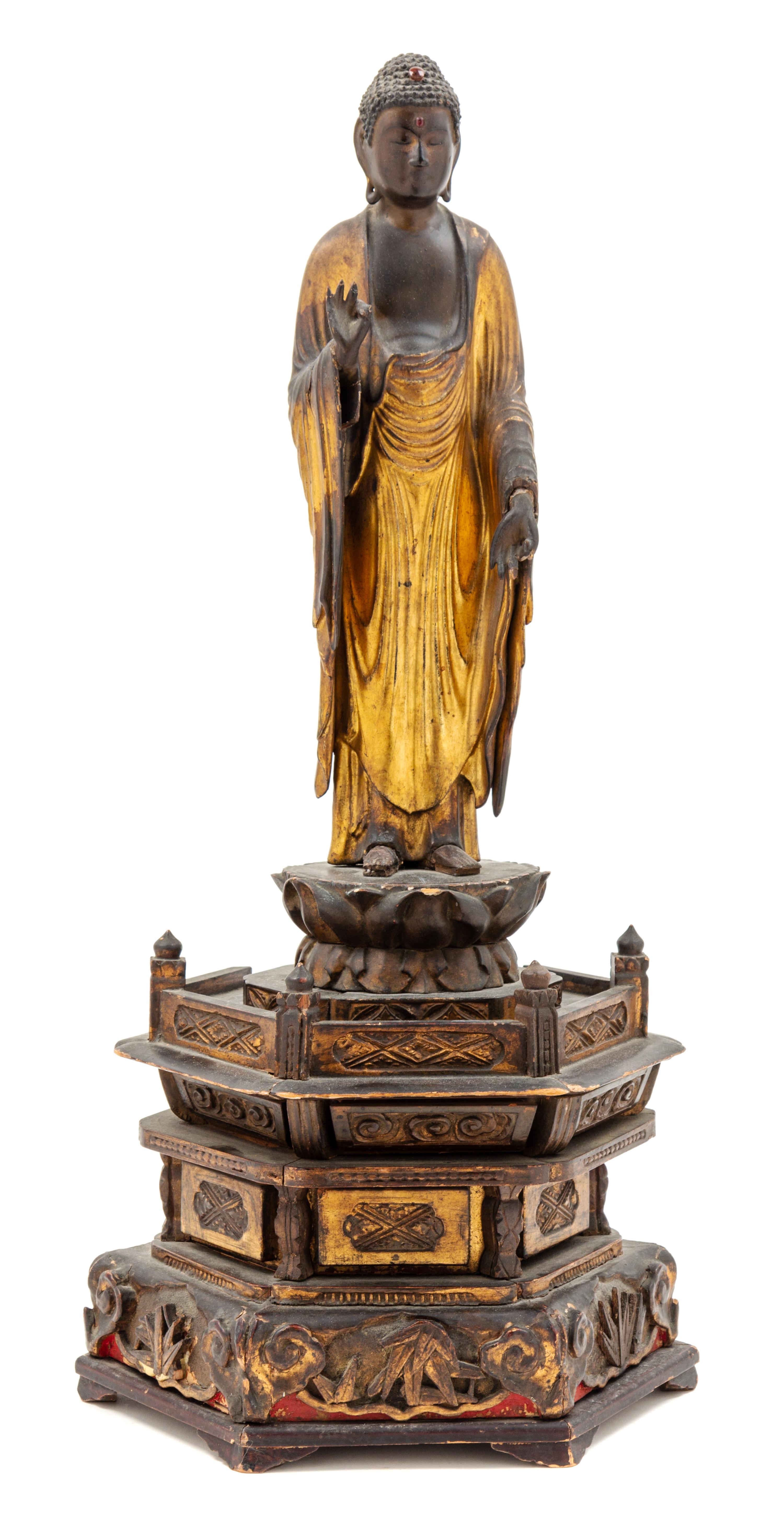 A Gilt Lacquered Wood Figure of Buddha Height overall 33 1/2 inches. — 19TH CENTURY