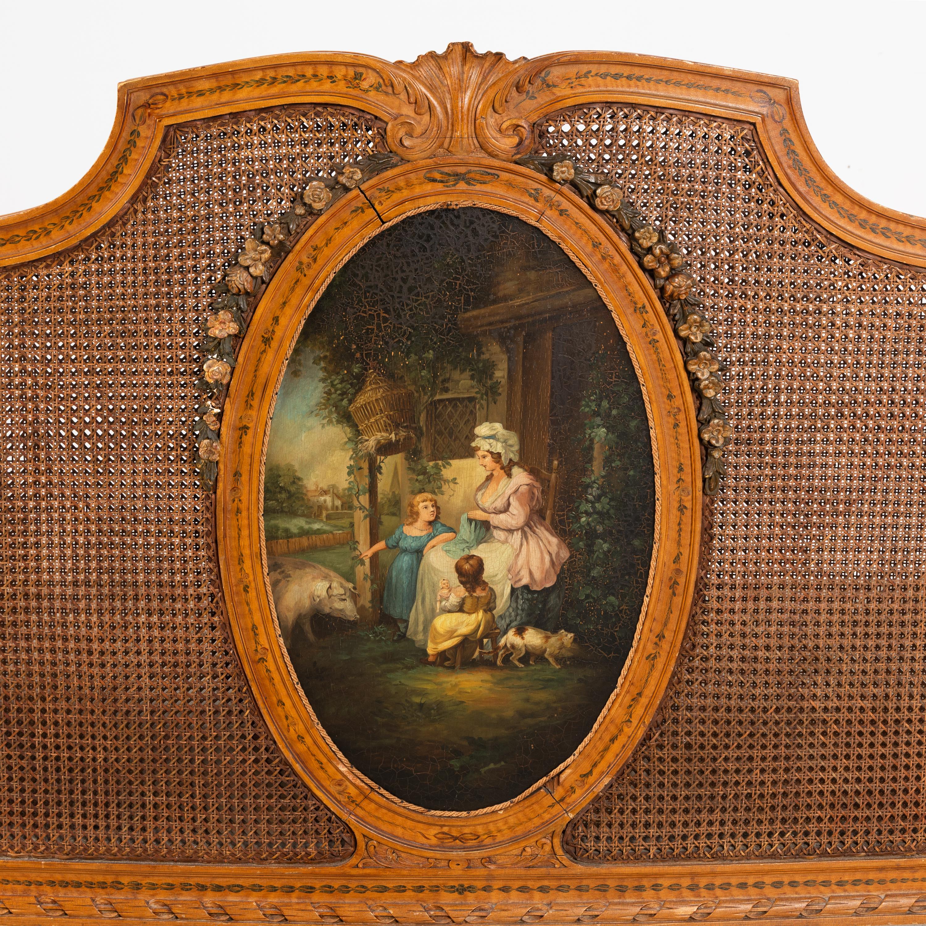 An Edwardian Satinwood and Polychrome Painted Headboard and Footboard