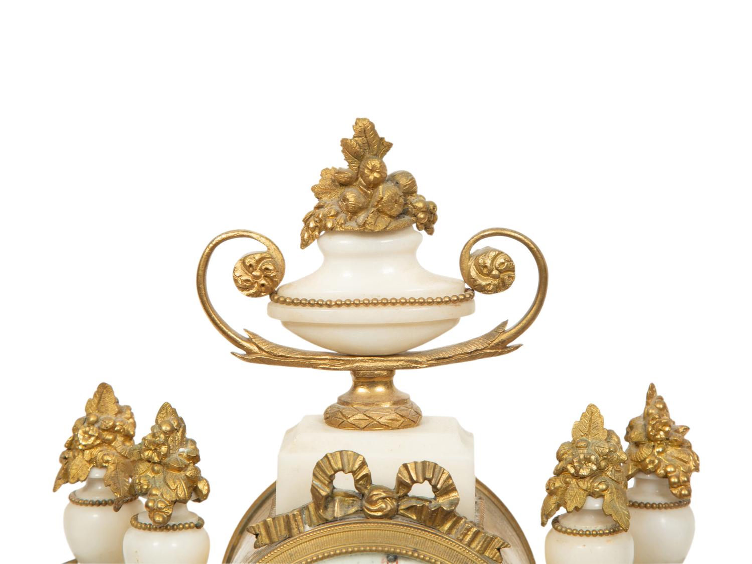 An Empire Style Gilt Bronze Mounted Marble Portico Clock