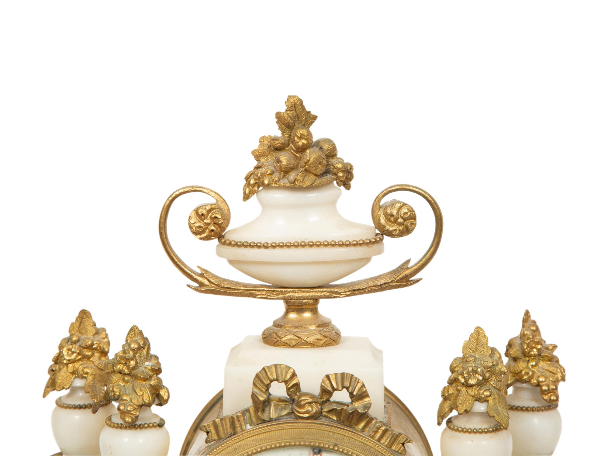An Empire Style Gilt Bronze Mounted Marble Portico Clock