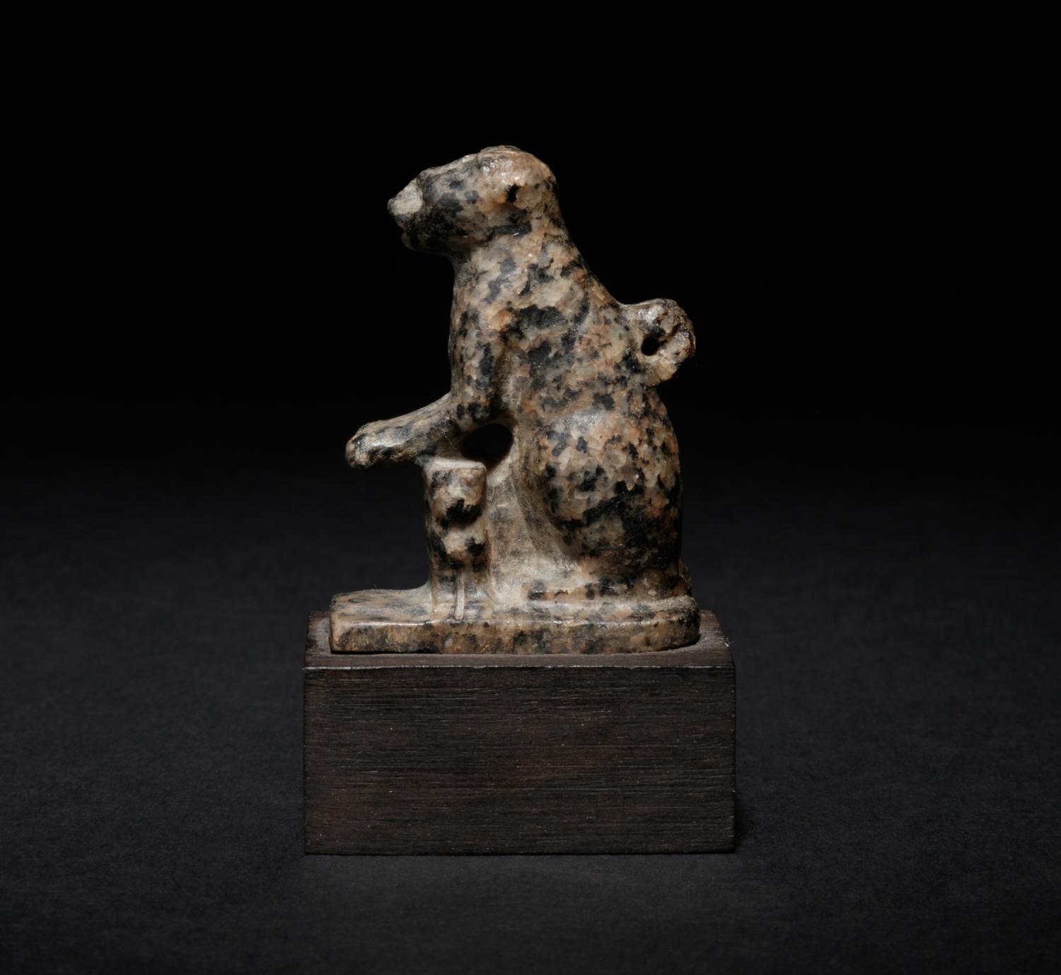 An Egyptian Granite Amulet of a Cat with Kittens