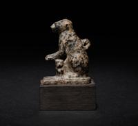 An Egyptian Granite Amulet of a Cat with Kittens