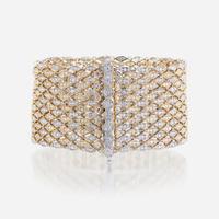 A bicolor fourteen karat gold and diamond bracelet