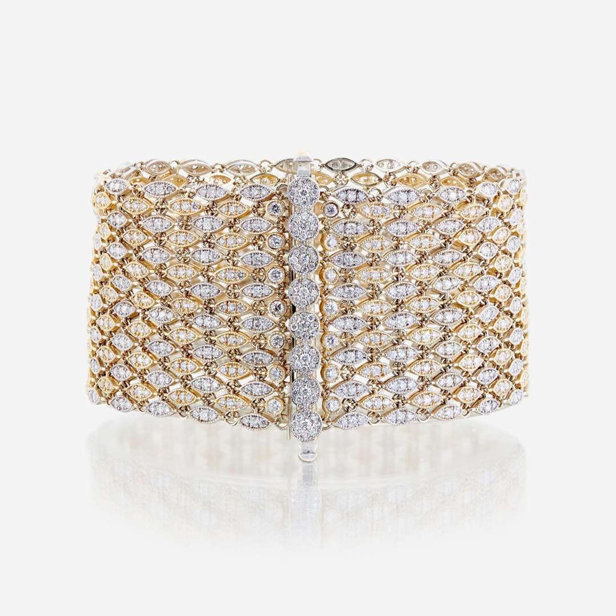 A bicolor fourteen karat gold and diamond bracelet