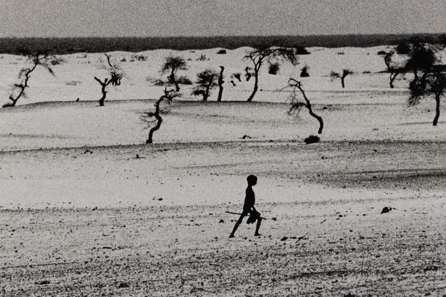 Sebastião Salgado (born 1944) This used to be the large Lake Faguibine. It dried up little by little with the drought and invasion of the desert. All the men have gone, only the children, the elderly and the women remain, Mali, 1985