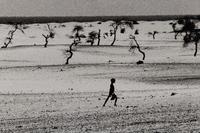 Sebastião Salgado (born 1944) This used to be the large Lake Faguibine. It dried up little by little with the drought and invasion of the desert. All the men have gone, only the children, the elderly and the women remain, Mali, 1985