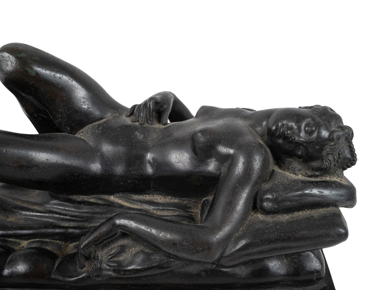 A Cast Bronze Figure of a Reclining Nude Woman